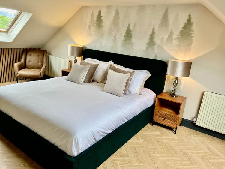 Modern bedroom at ApartNest accommodation in Auchterarder, Scotland.