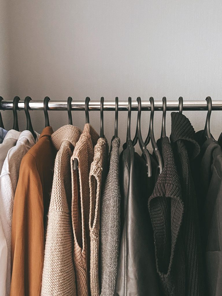 Versatile clothing essentials for packing for an apart hotel stay in Auchterarder, Scotland.